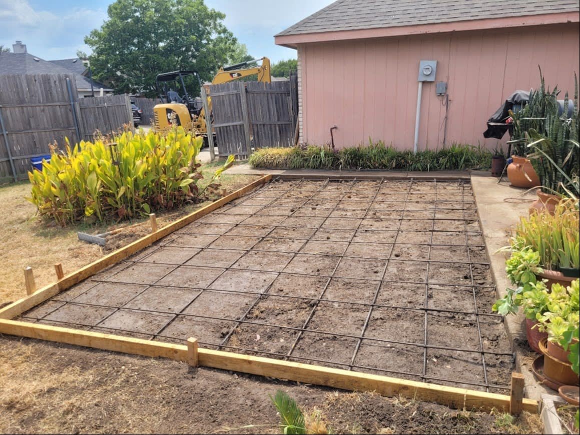 Freshly poured concrete slab foundation on a Texas property