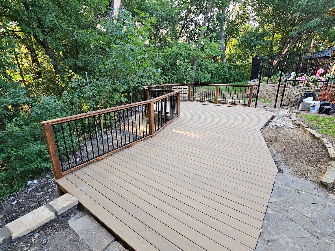 Composite decking boards along a backyard patio