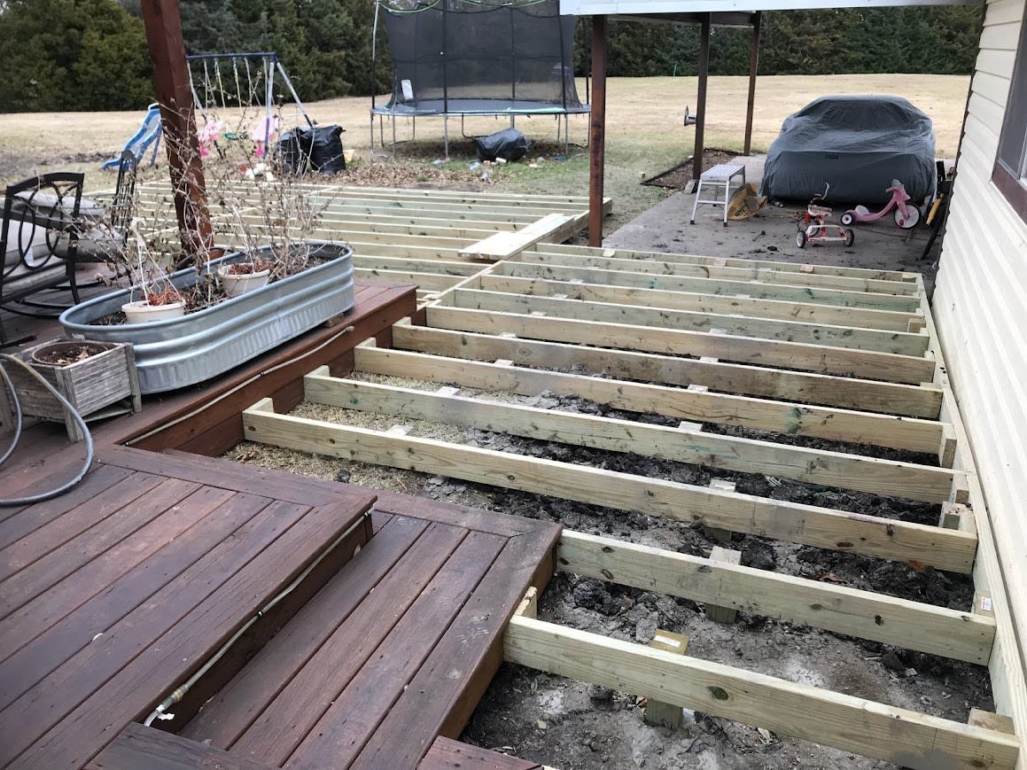 Custom wooden deck attached to a Dallas home