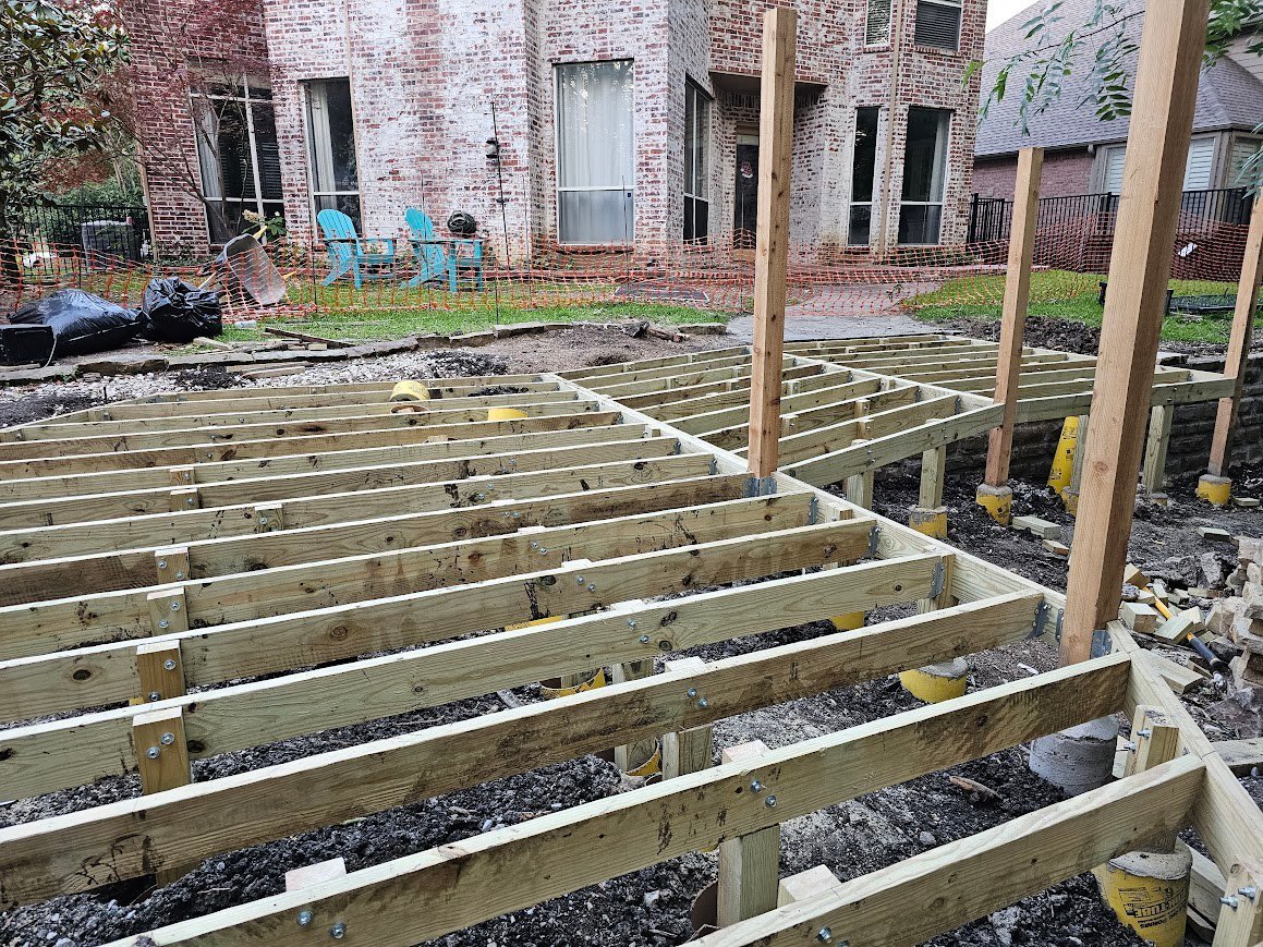 Multi-level wooden deck in a residential yard