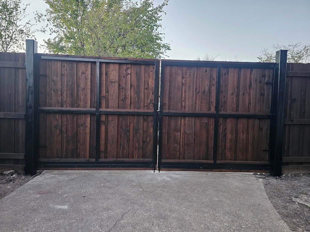 Steel slide gate along a driveway entrance