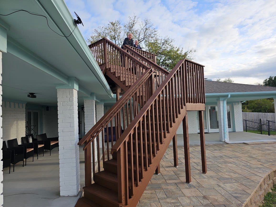 Custom balcony extending a Texas home's outdoor living space