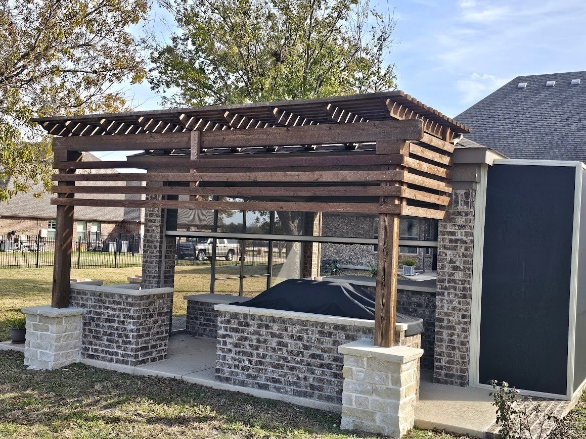 Wood pergola providing shade over a backyard patio